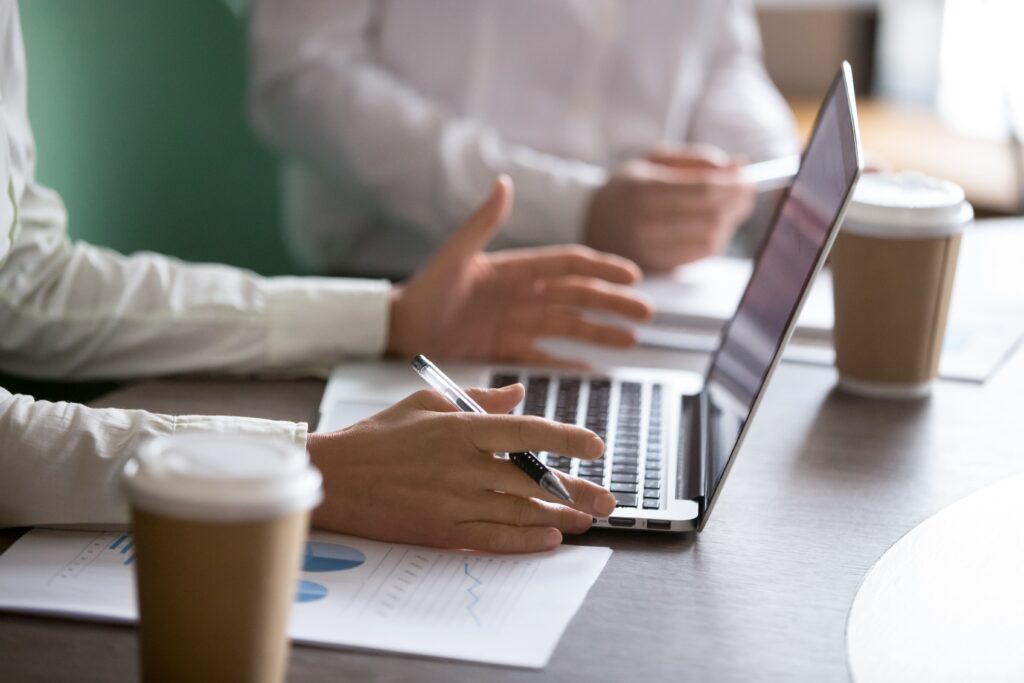 stock_landing1 Businesswoman Using Laptop Presenting Project Report Business Meeting Closeup 1 1024x683